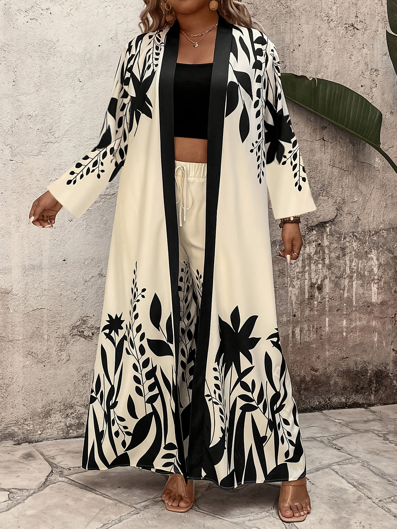 2pcs tropical leaf print plus size maxi coat & wide leg pants set oversized elegant maxi dress with belted jacket machine washable winter winter outfits in black/beige/white/gray for beach outings, casual to formal events stylish & comfortable plus size clothing with long sleeve top and matching pants, relaxed fit, chic plant pattern, and secure belt detail 2pcs tropical leaf print plus size maxi coat & wide leg pants set oversized elegant maxi dress with belted jacket machine washable winter winter outfits in black/beige/white/gray for beach outings, casual to formal events stylish & comfortable plus size clothing with long sleeve top and matching pants, relaxed fit, chic plant pattern, and secure belt detail